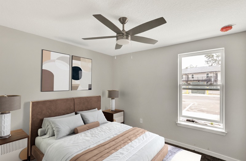 Bedroom with ceiling fan at Huntington Forest