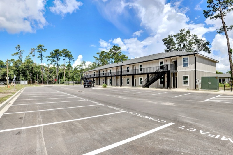 Apartment building and parking lot at Huntington Forest