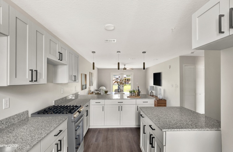 Galley kitchen with granite countertops at Huntington Forest