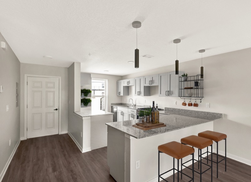 Kitchen with bar seating at Huntington Forest